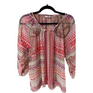 A Tanjay sheer blouse in size 12